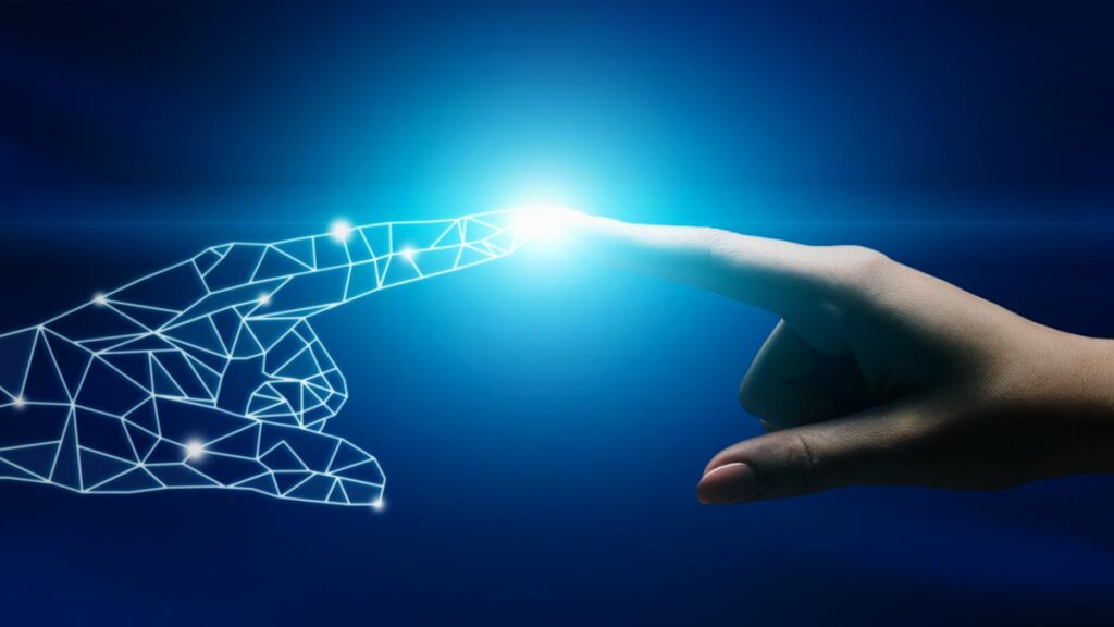 Die Zeigefinger einer weiblichen Hand und einer Roboterhand berührern sich. (c) AdobeStock